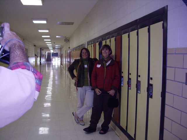 Julie Booth and Nancy Pepp next to our locker during school tour.